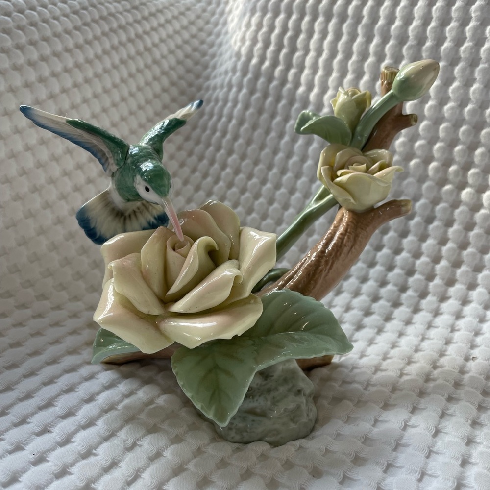 Ceramic hummingbird on flower figurine.